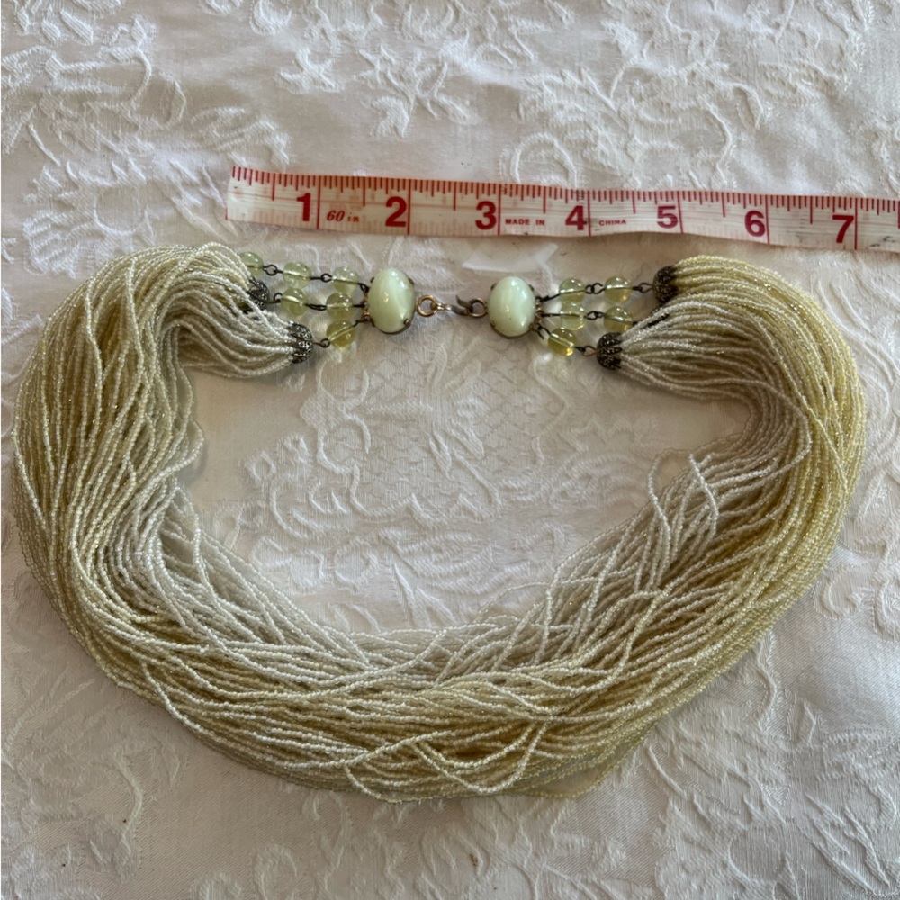 Vintage yellow multstrand necklace.